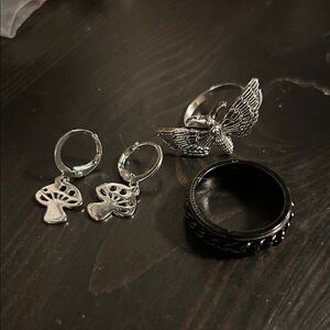 Silver Butterfly Ring, Black Fidget Ring, and Silver Mushroom Earrings